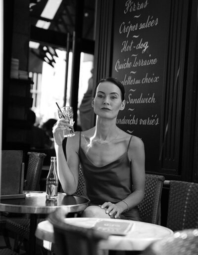 black and white photo of beautiful woman solo in Paris