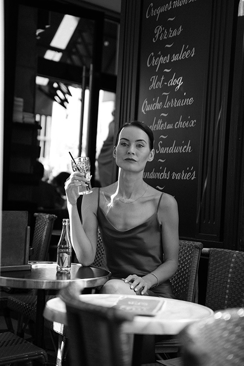 black and white photo of beautiful woman solo in Paris